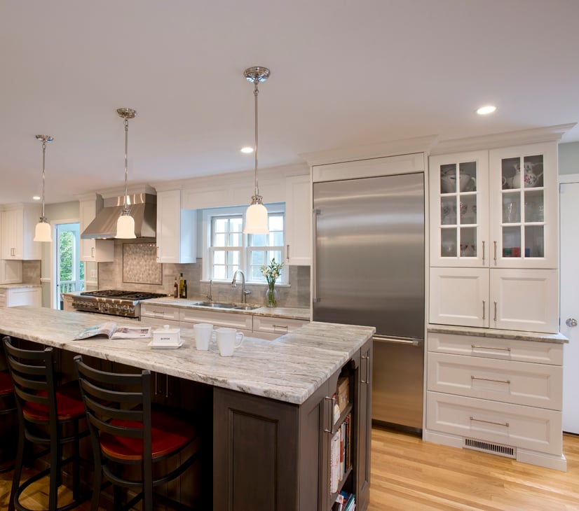 Clark Construction's Wilton kitchen with a bi-level island in rustic brown fantasy.