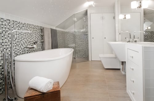 Modern Bath with white freestanding tub and mosaic tile