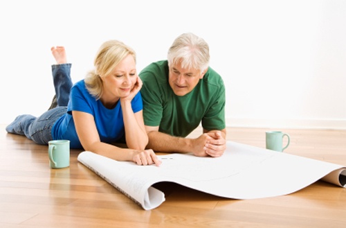 couple looking at remodeling plans