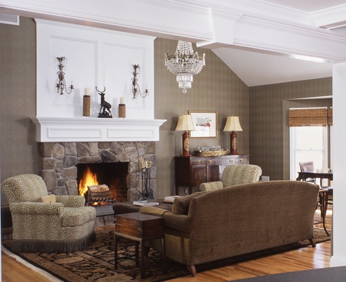 Wilton Connecticut living room with fireplace with glowing fire.