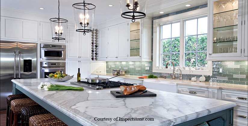 White cabinets with white marble counter from inspectstone.com