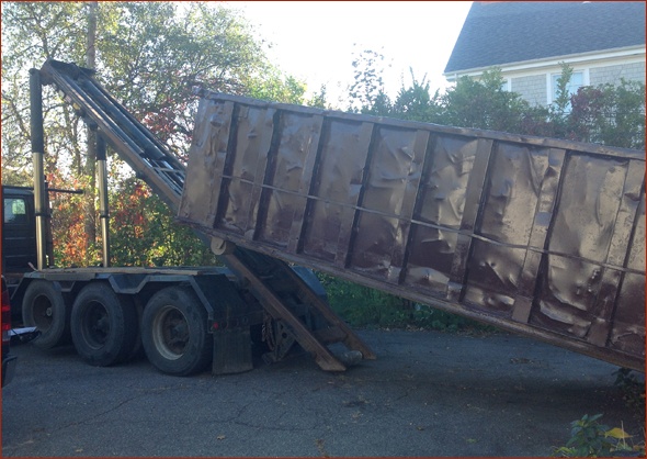 dumpster being delivered