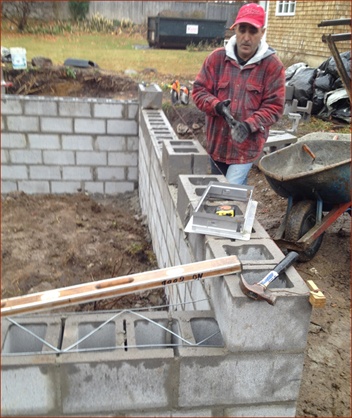 mason ready to install flood vents
