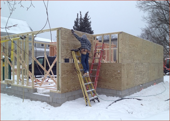 framing and sheathing take place on the garage.