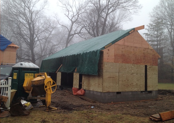 garage is tarped to keep the weather out