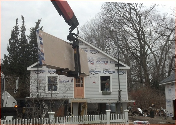sheetrock is passed through the front window