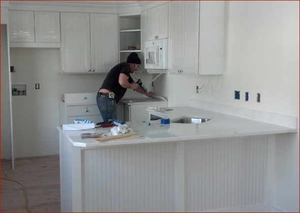 kitchen cabinets and counters have been installed