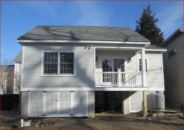 back of the cottage, with covered porch
