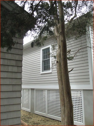 Lattice panels wrap the house on all sides