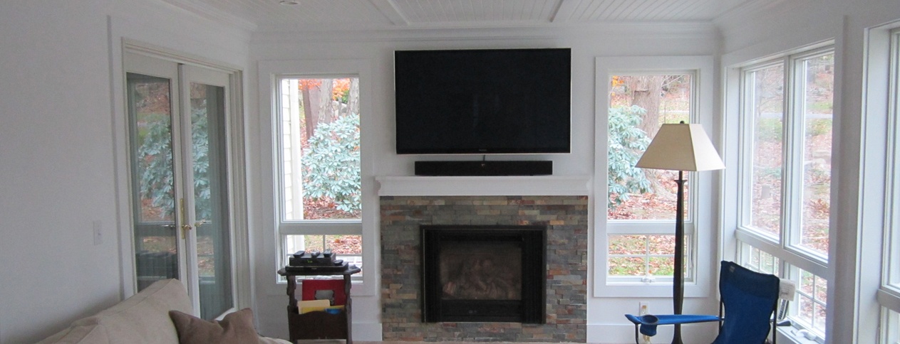Clark Construction designed and built sun room with fireplace in Ridgefield, CT