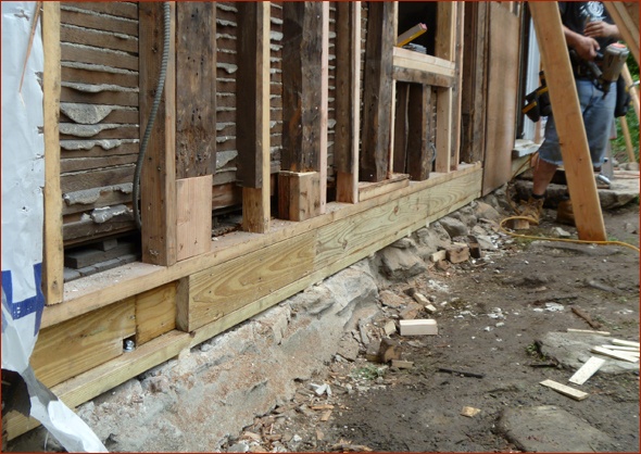 Replaced sill plate and strengthened framing.