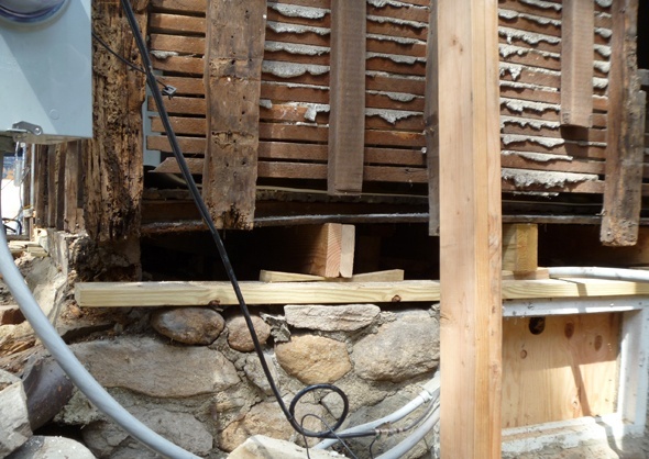 Lower section of walls removed to allow for new foundation to be built.