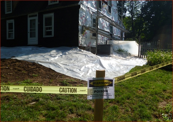 Ground is covered with plastic and caution signs have been posted on this CT renovation.