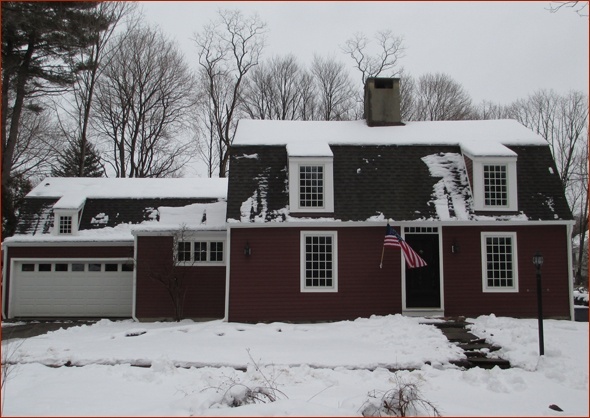 Clark Construction's renovations complete - New Canaan's second oldest home after a snow storm.
