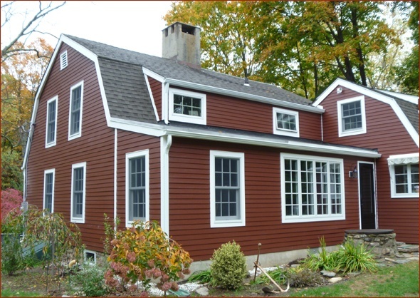 Historically correct set of windows grace the back of this New Canaan antique home renovated by Clark Construction of Ridgefield.
