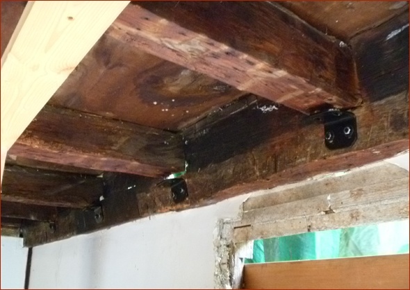 Original beams holding up the second floor.