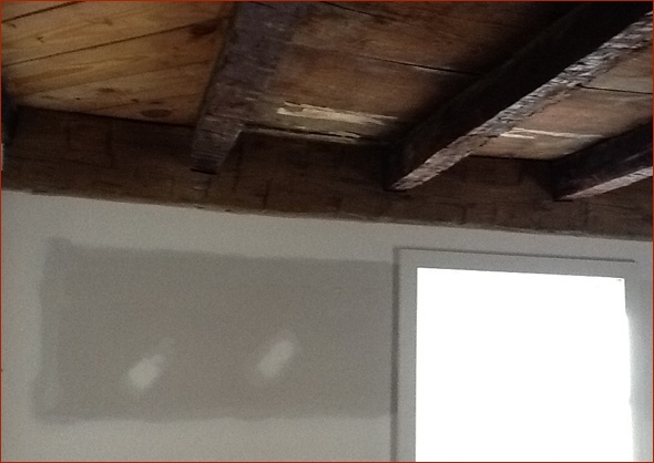 Antique beam installed with precision.