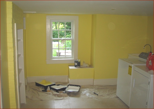 Bright yellow laundry room