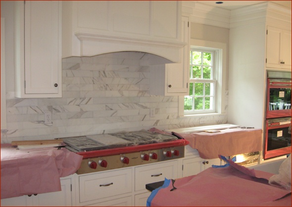 The backsplash is carerra marble tile