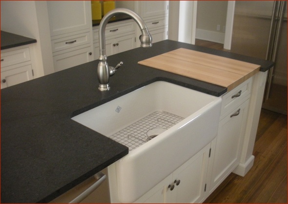 Island with butcher block and farm sink