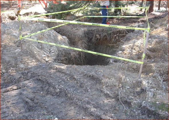 Hole dug for large propane tank.