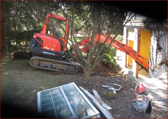Slider has been removed and excavator reaches into break up the pool.