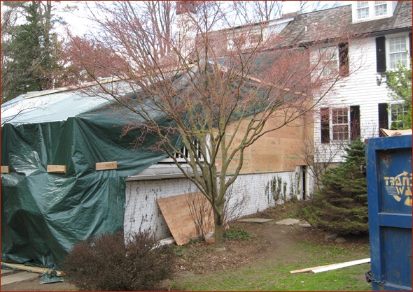 Keeping things dry with massive tarps.