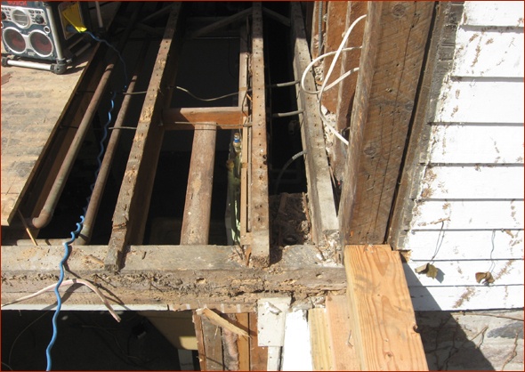Extensive rot seen at the connection of the addition to the home.