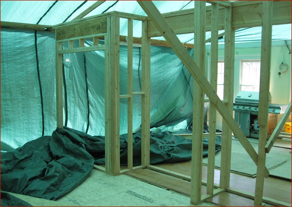 A look under the tarp. Kitchen and great room are taking shape.