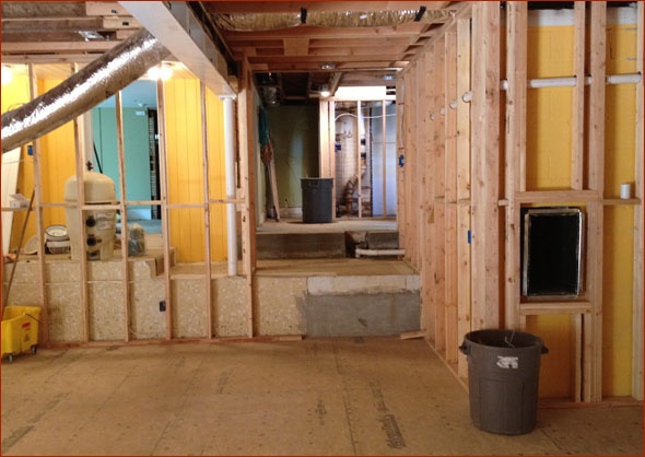 Stairs will be installed next, descending from mudroom to lower level.