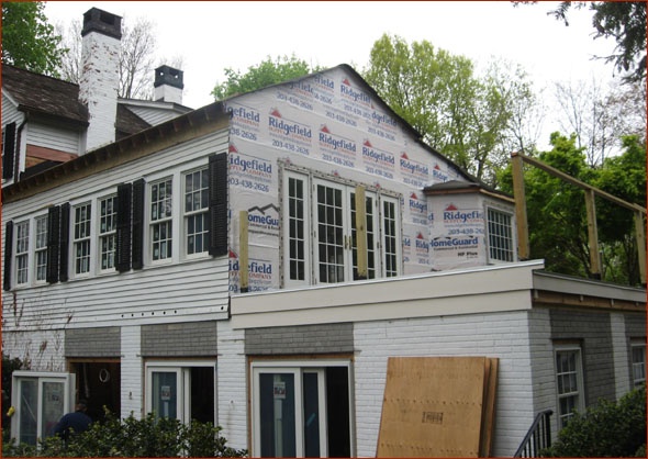 The roof is covered with builder's felt, awaiting the roof shingles.