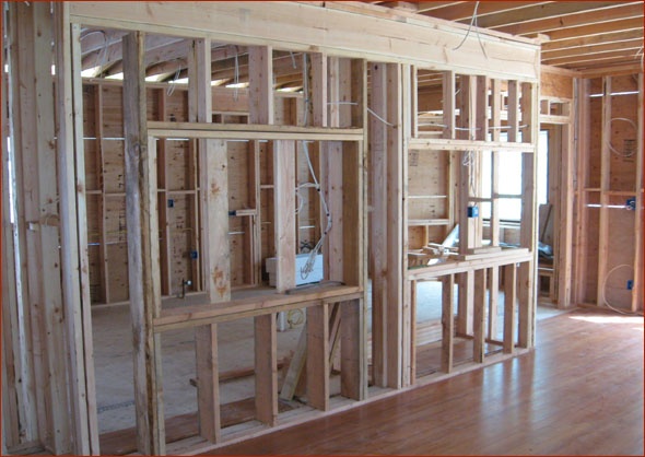 Great room and kitchen walls are framed.