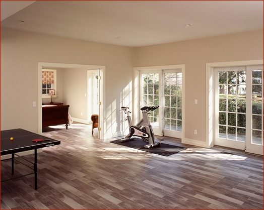Lower level playroom with guest quarters highlight the lower level of this historic renovation project in New Canaan CT by Clark Construction.