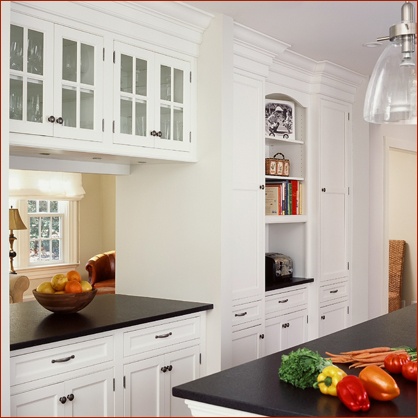 Pass through between the kitchen and great room serves as bar buffet and homework center.