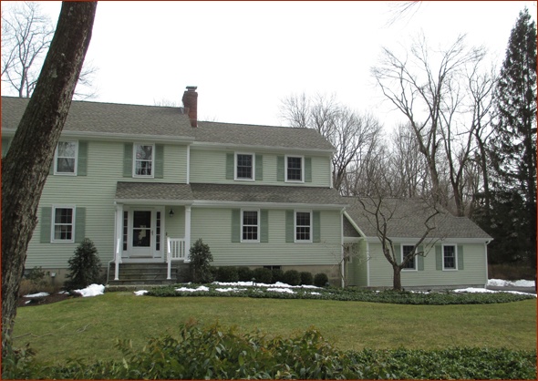 New roof lines work seamlessly with the existing home in Wilton, CT