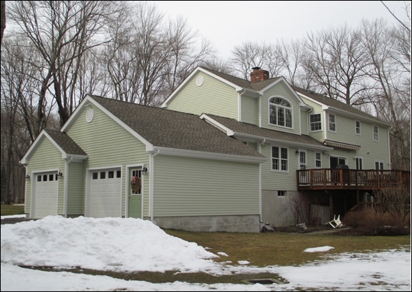 Clark Construction's completed master bedroom addition in Wilton CT viewed from the back