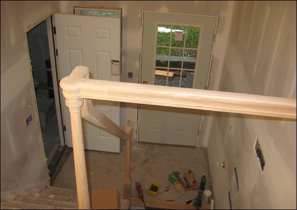 newel posts and banister in the mudroom entry