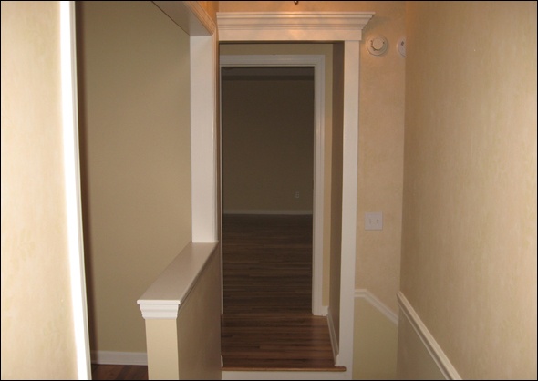 master bedroom can be seen down the hallway