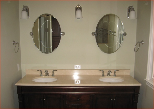 Vanity with honed marble top.