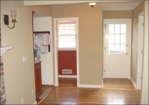 Oak flooring flows smoothly through three rooms