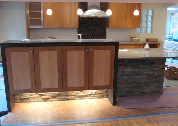 Lighting below the cabinets makes them float above the floor