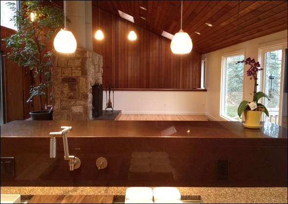 Contemporary kitchen makes use of different stone materials