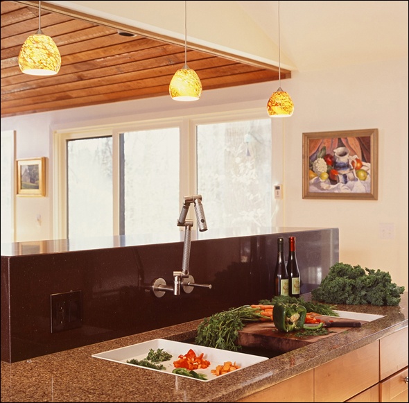 Close up of the island in this mid century Kitchen in CT with multiple counter materials