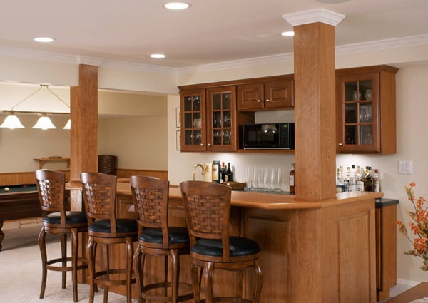Beautifully crafted bar and game room in basement remodel by Clark Construction.