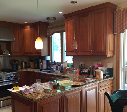 Before image of dark kitchen with pennisula before Clark Construction overhaul