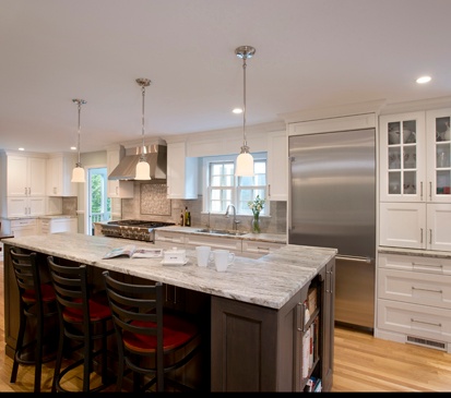 Clark Construction's Wilton kitchen with a bi-level island in rustic brown fantasy.