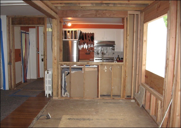 A half wall provides for a future breakfast counter