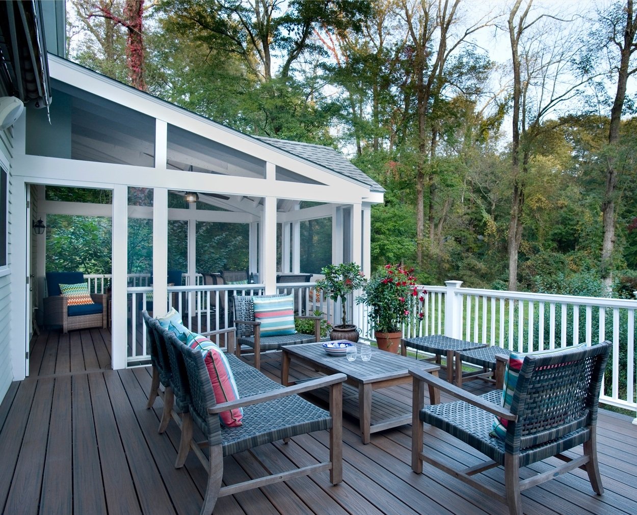 Colorful cushions add detail to outdoor furniture on a Trex deck.