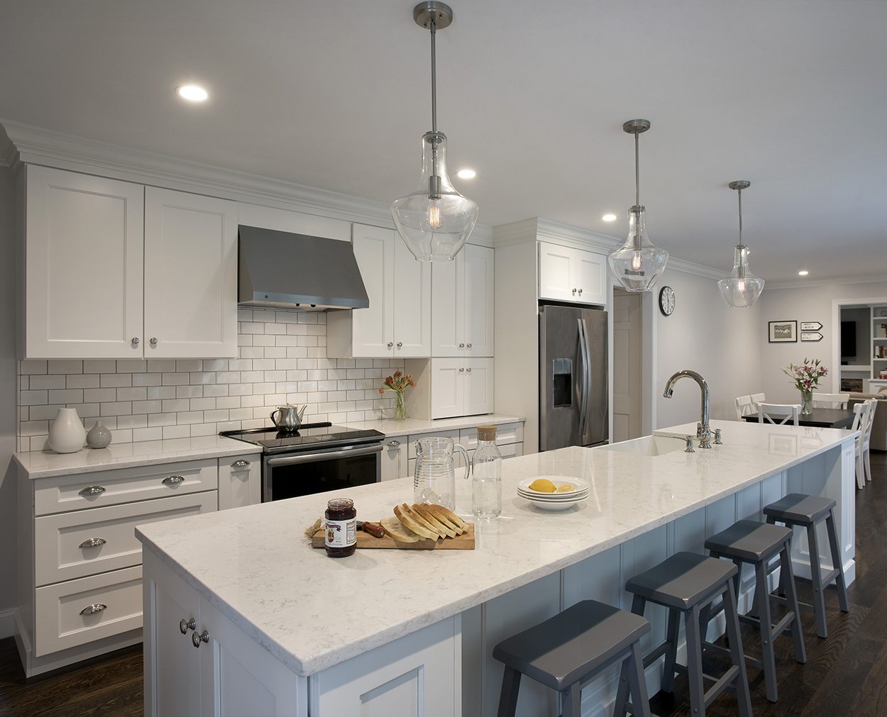 Kitchen design with white cabinets and a large island