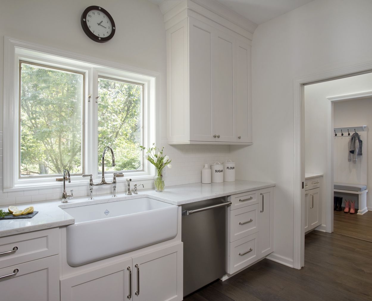 Rohl farm sink with a glimpse into the adjacent mudroom.